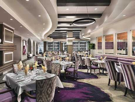 A dining room with tables set for service.