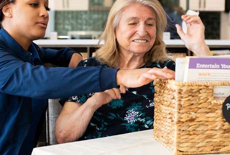 A person looking through a basket.