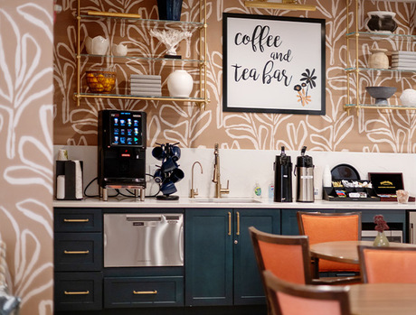 A cafe with a coffee and tea station.