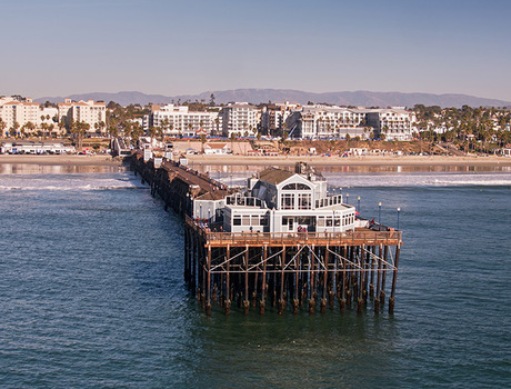 A pier jutting out into the ocean.