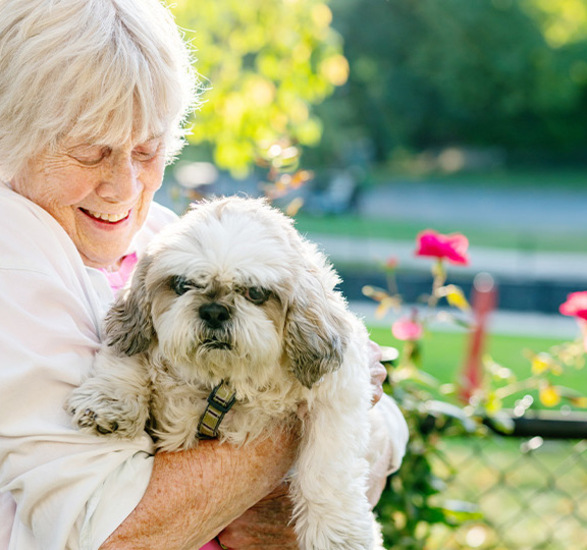 A person holding a dog.
