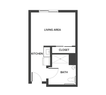 An assisted living studio suite floor plan with an open living/bedroom space and kitchenette.