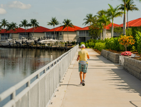 A person walking along the water.