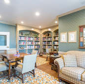 A library with a table for activities.