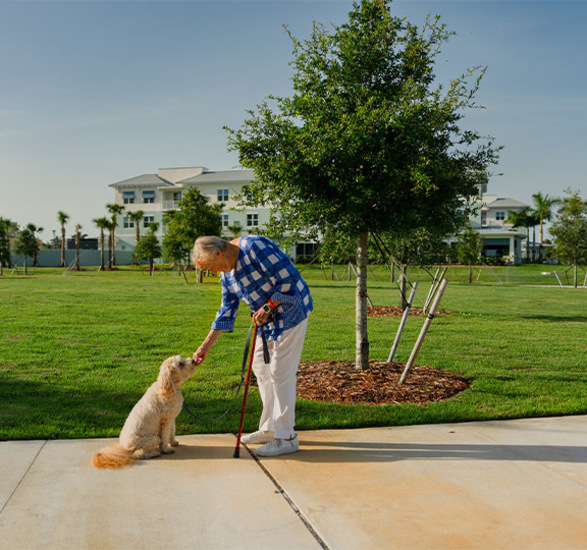 A person with their dog outside.