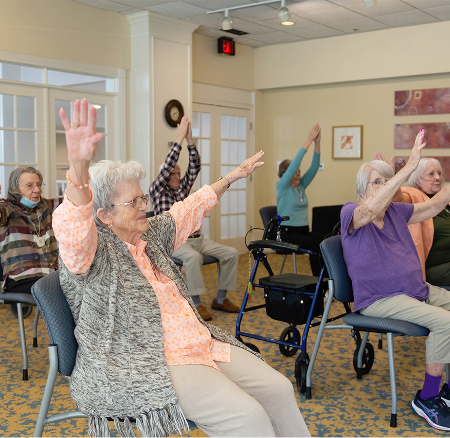 People doing seated stretching.