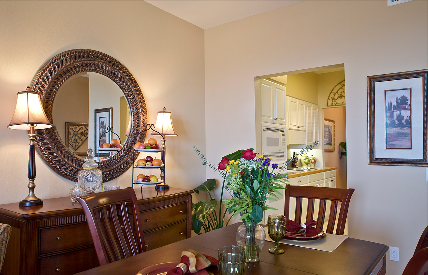 Dining room table set with plates and glasses.
