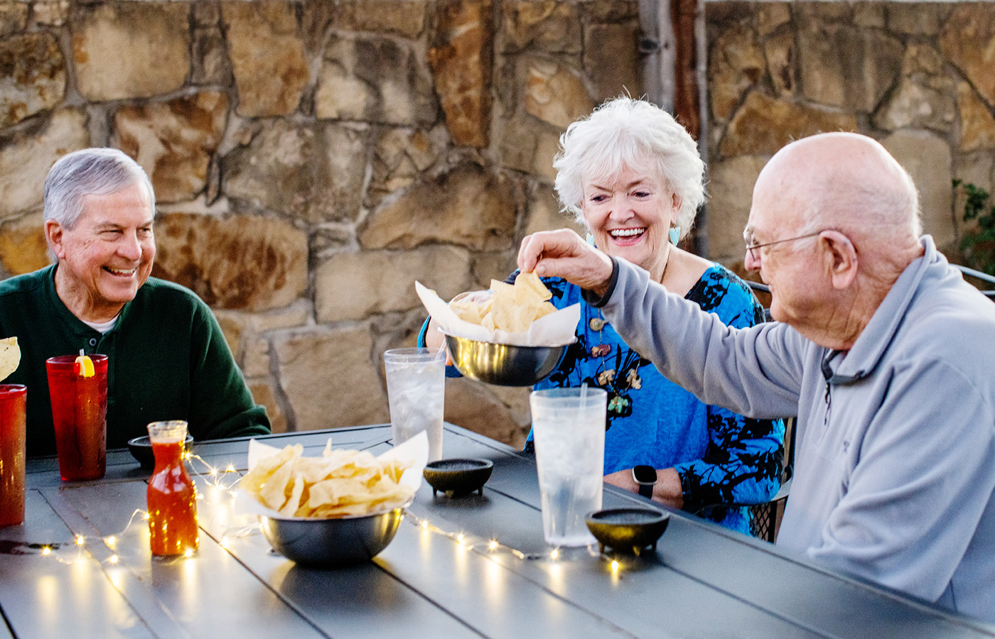 Residents enjoying drinks outside.