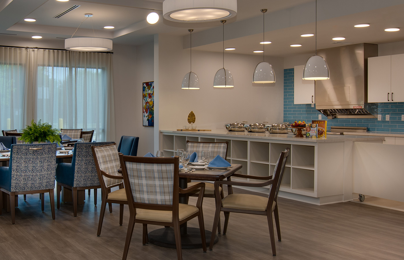 A dining room with baskets on the shelf.