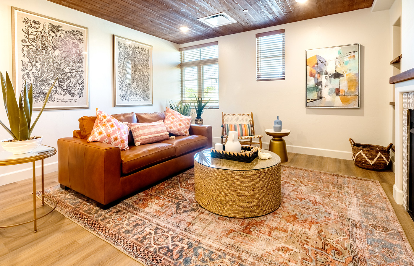 Fully furnished living room with couch and ottoman.