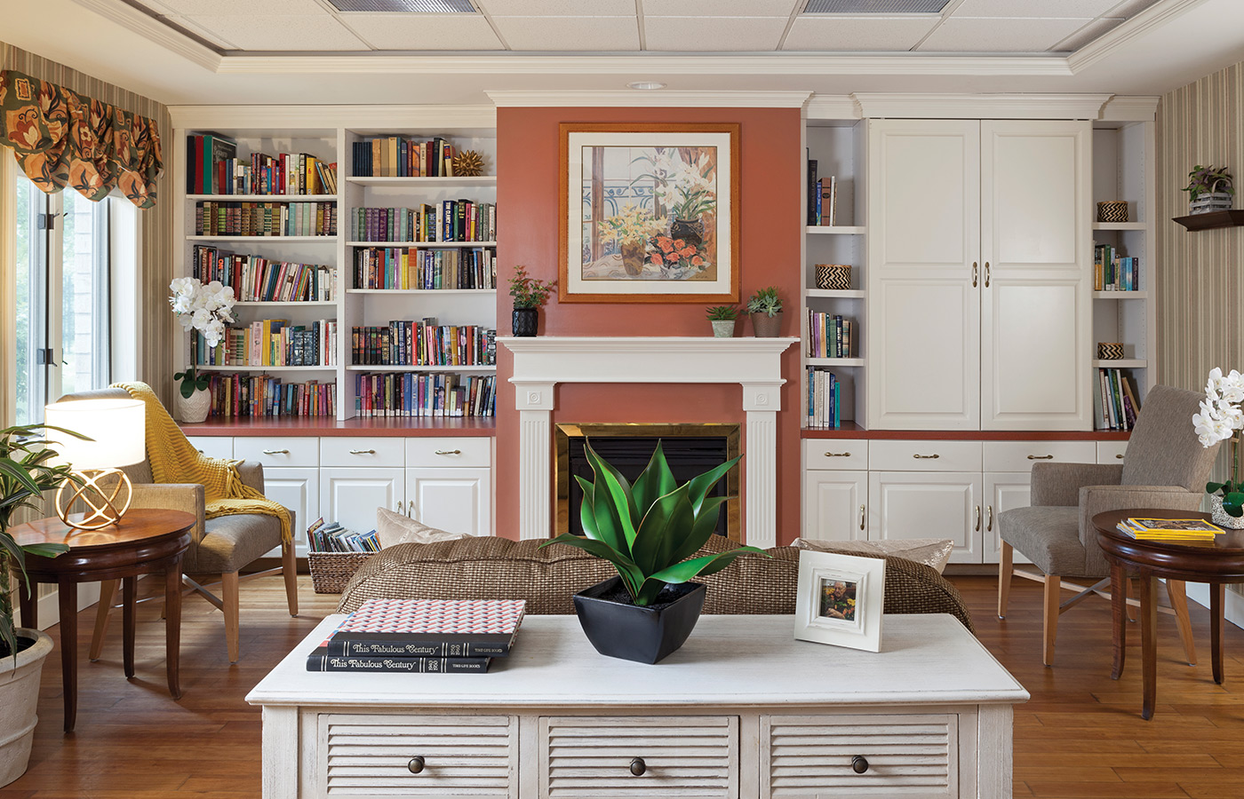 Fireplace with library and painting