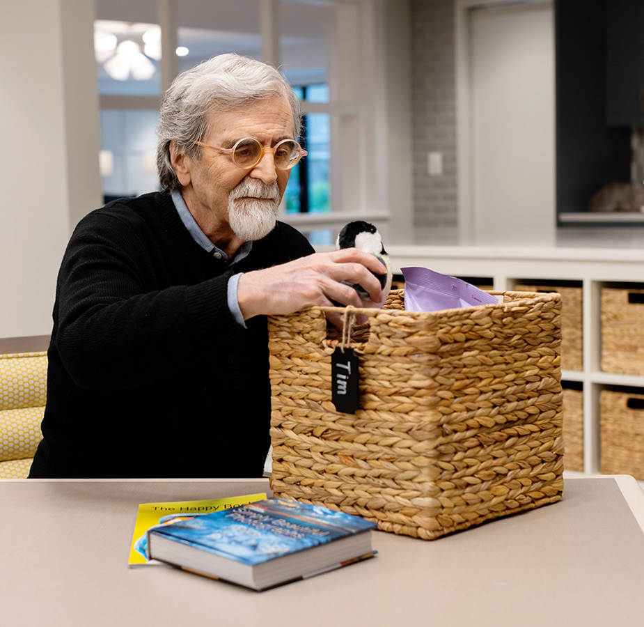 A resident looking through theirpantry program box.