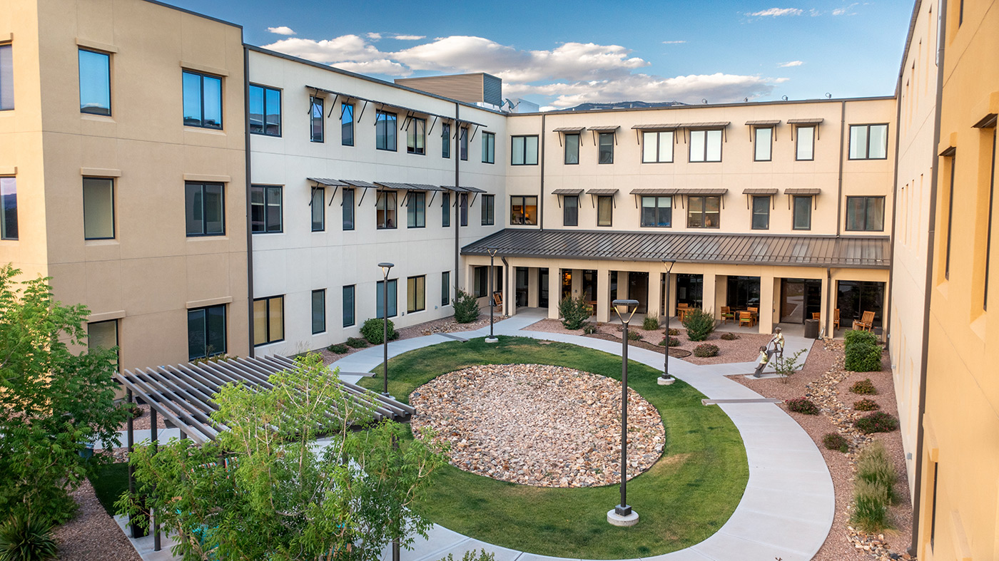 The Watermark at Cherry Hills building exterior with large circular pathway.