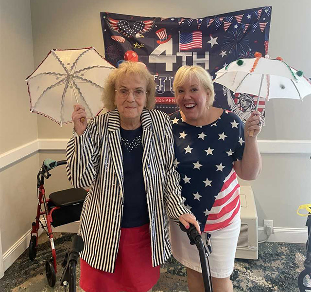 Two people with 4th of july umbrellas.