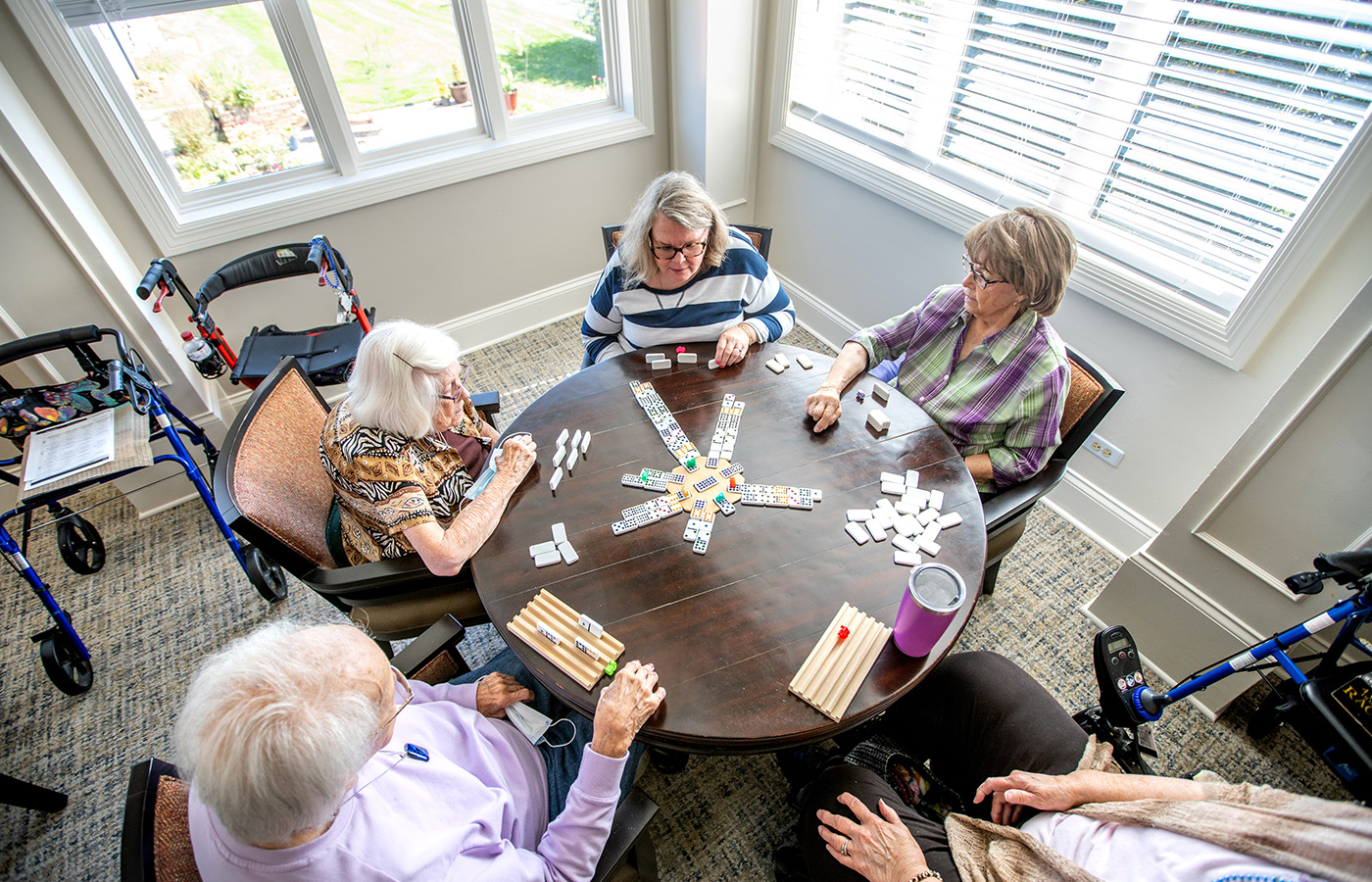 A group of people playing cards.