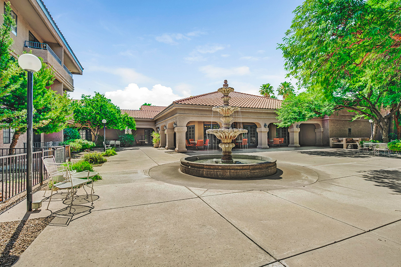 outside of community with a large fountain in the center