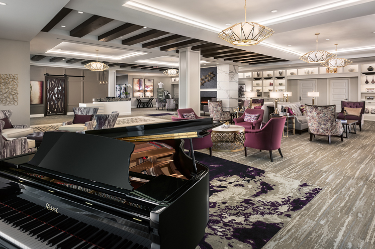 Lobby area with seating area and grand piano.