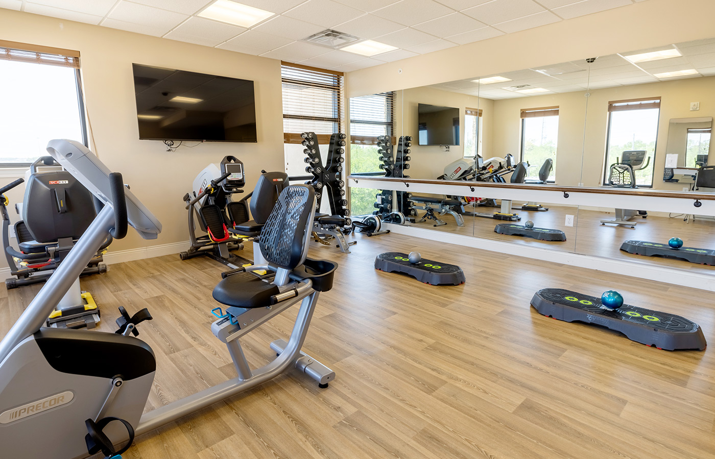 A fitness room with exercise equipment.
