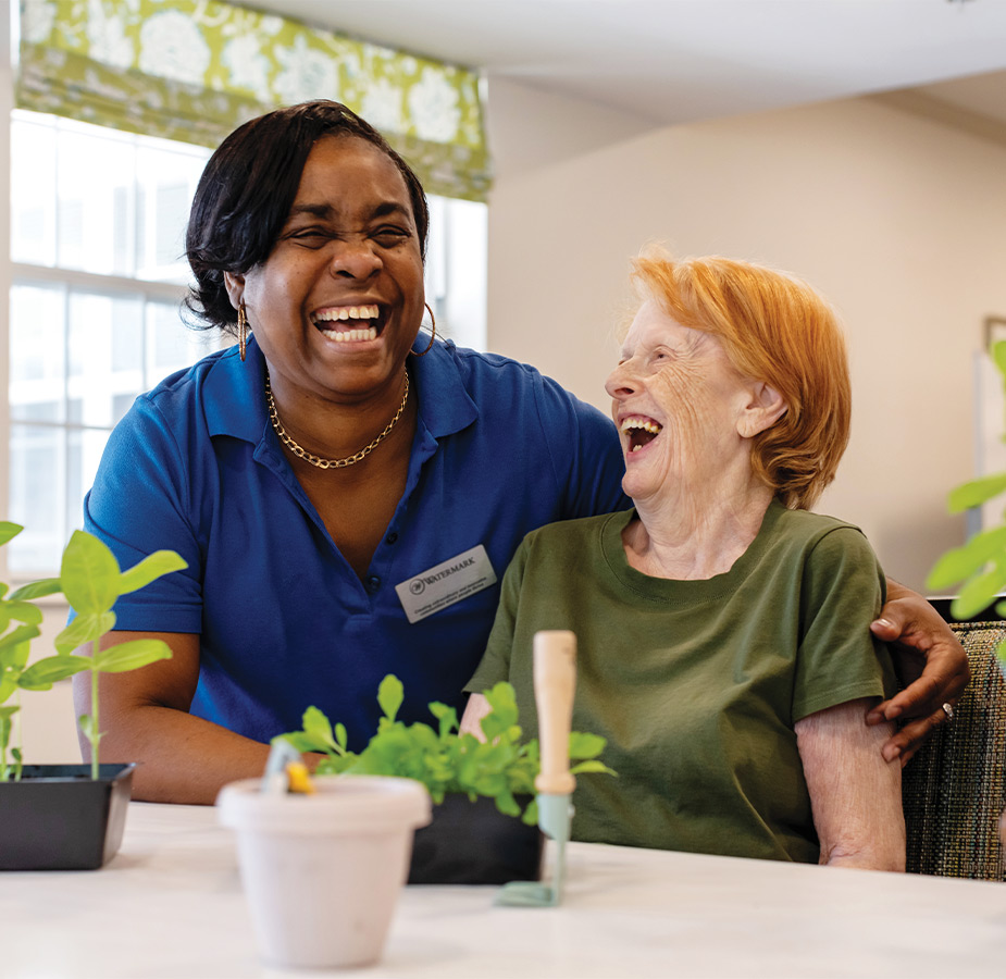 Two people laughing.