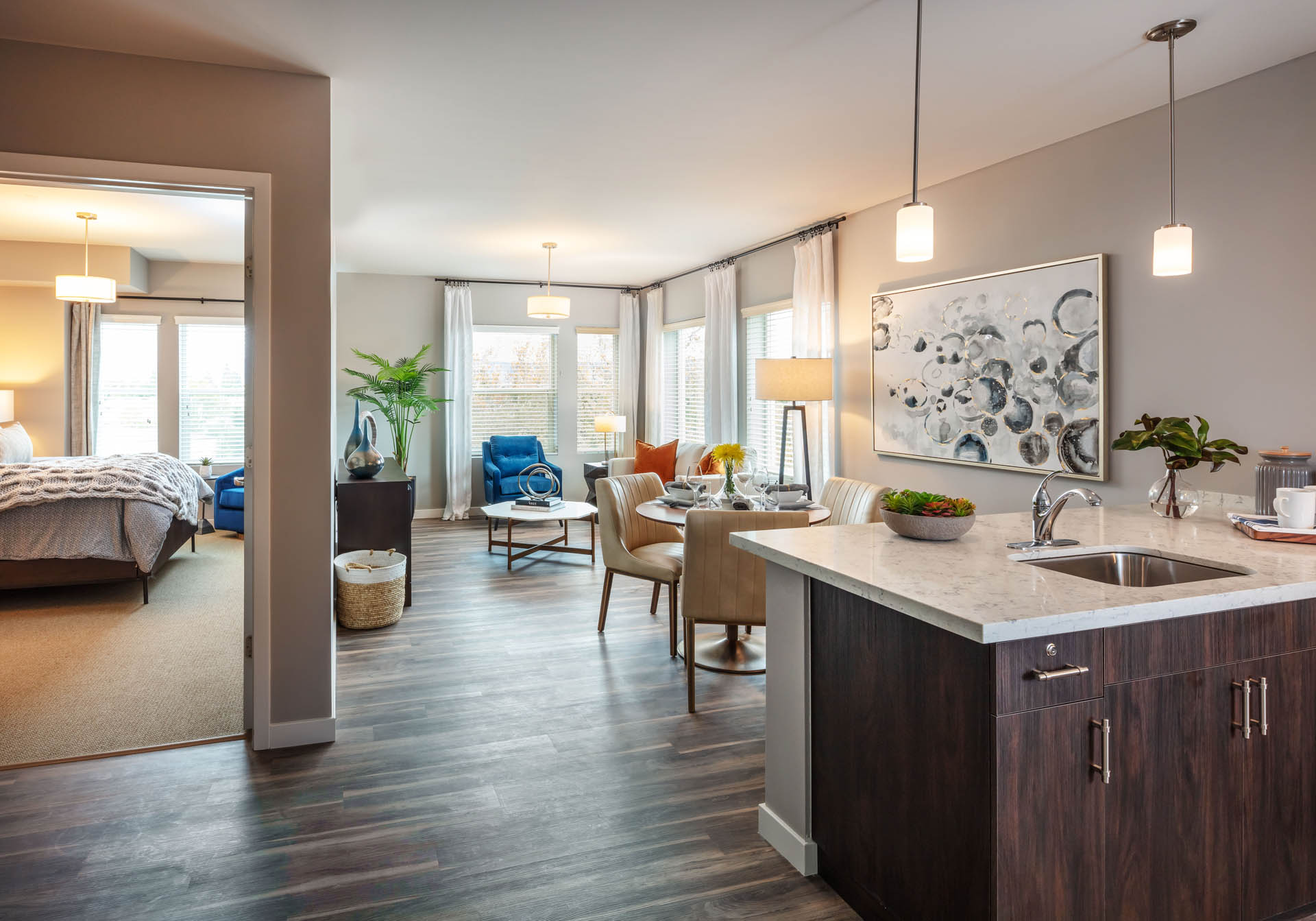 Furnished apartment with a kitchen, living room, and bedroom. 