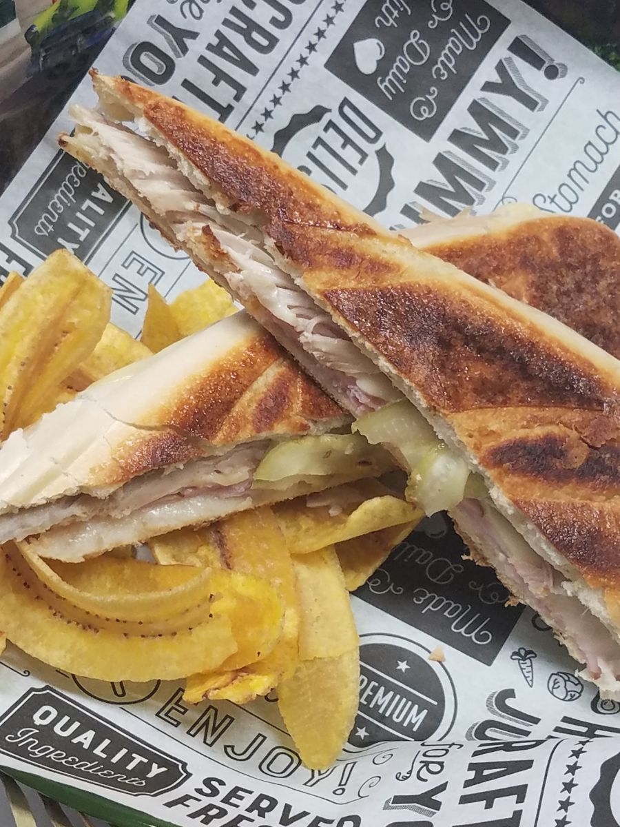 A Cuban Sandwich with plantain chips.