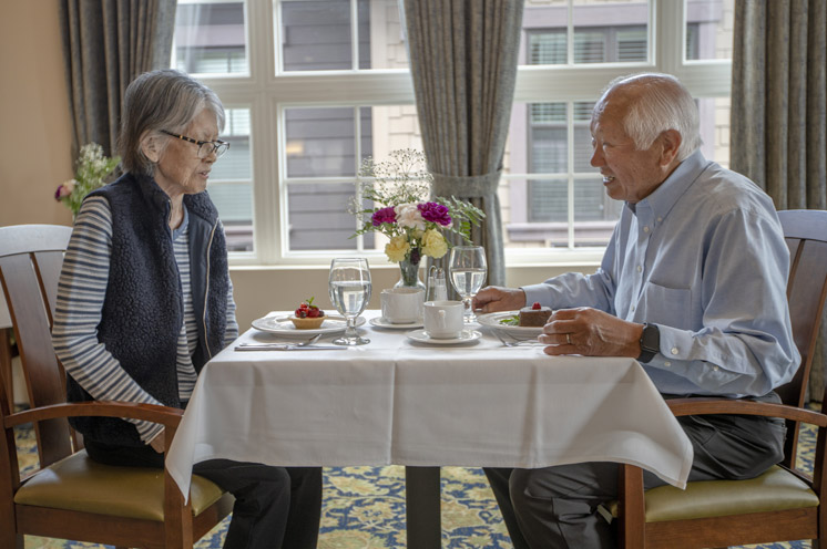 Two residents are having a meal together.