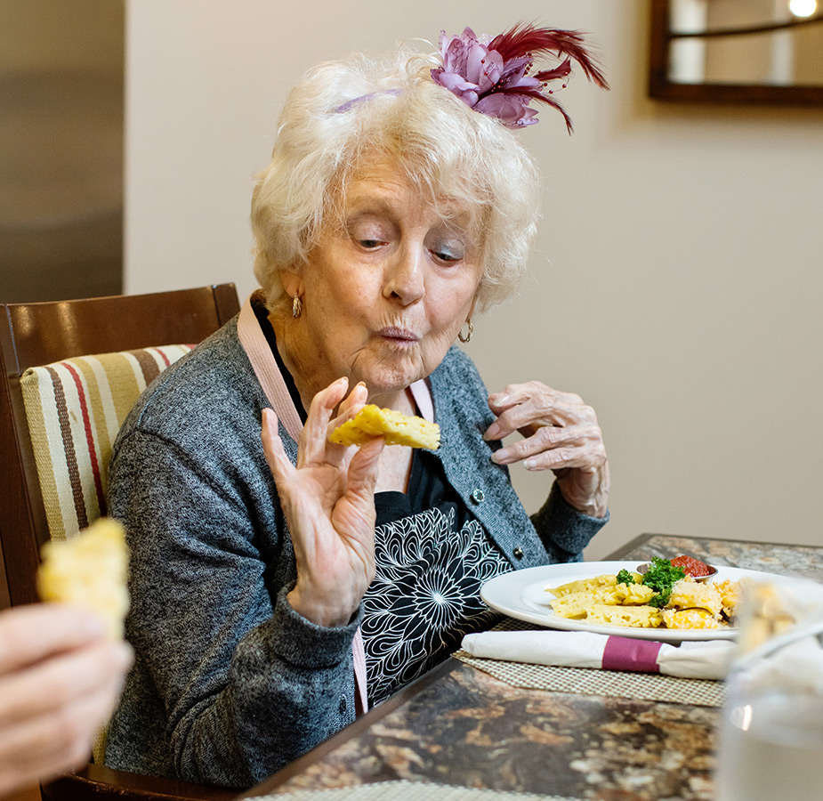 A person eating gourmet bites.