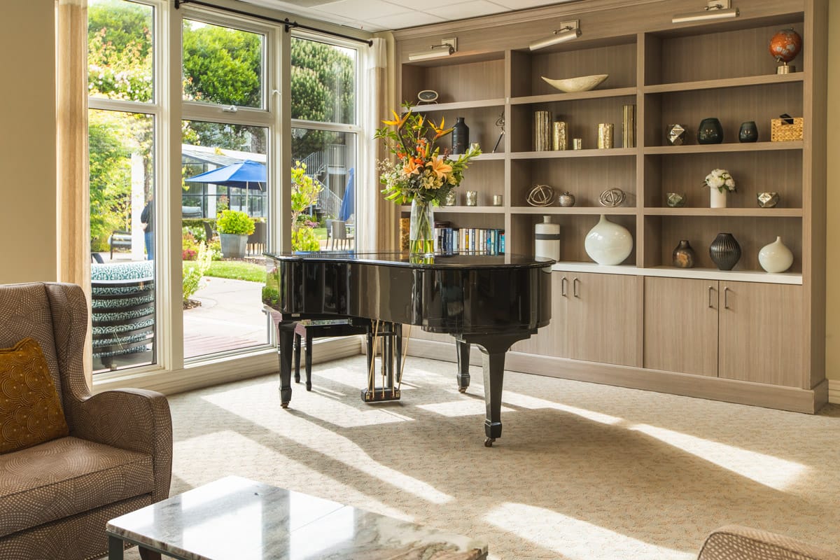 Seating area by piano.