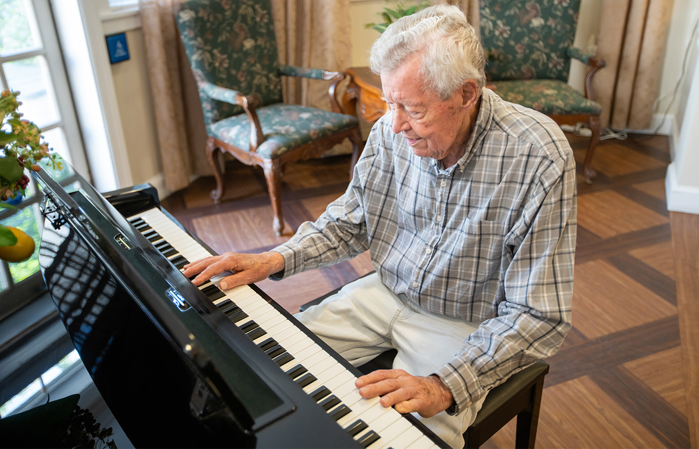 A resident is playing a piano