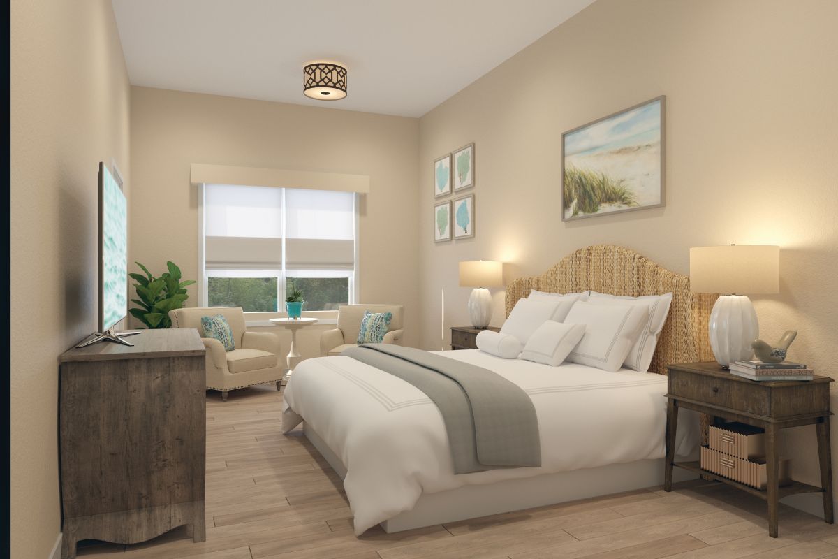 Studio apartment with a window, bed, dresser and side table.