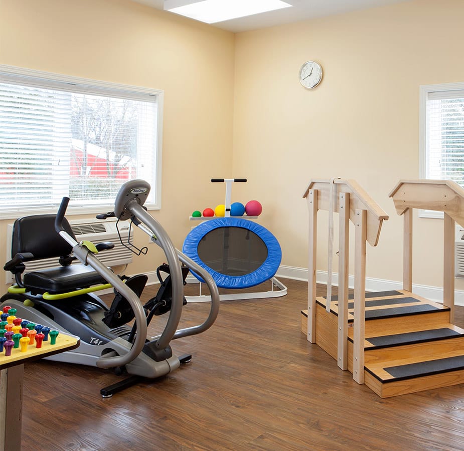 The Fountains at Albemarle Wellness An assortment of fitness equipment including a bike, trampoline and stairs with railing found on-site at The Fountains at The Albemarle.