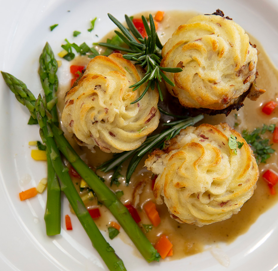 Bite sized food on a plate.