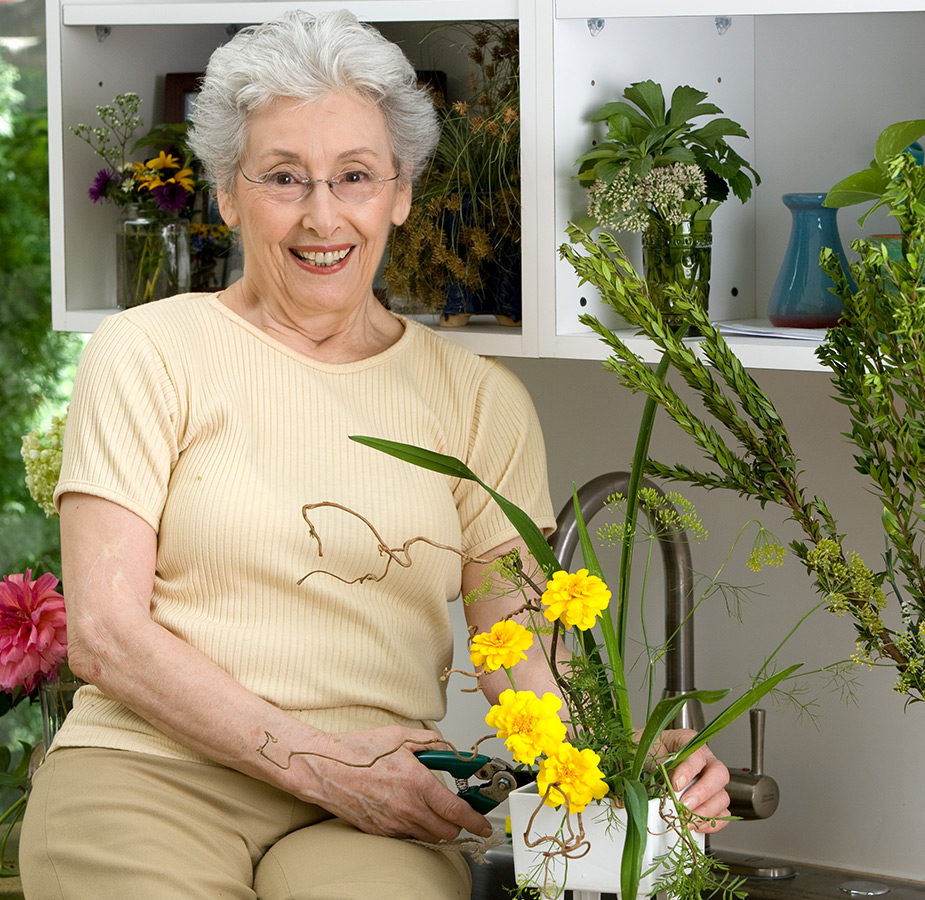 Happy resident enjoying gardening.