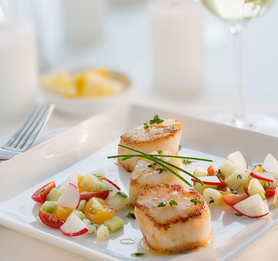 Baked scallops on a plate.