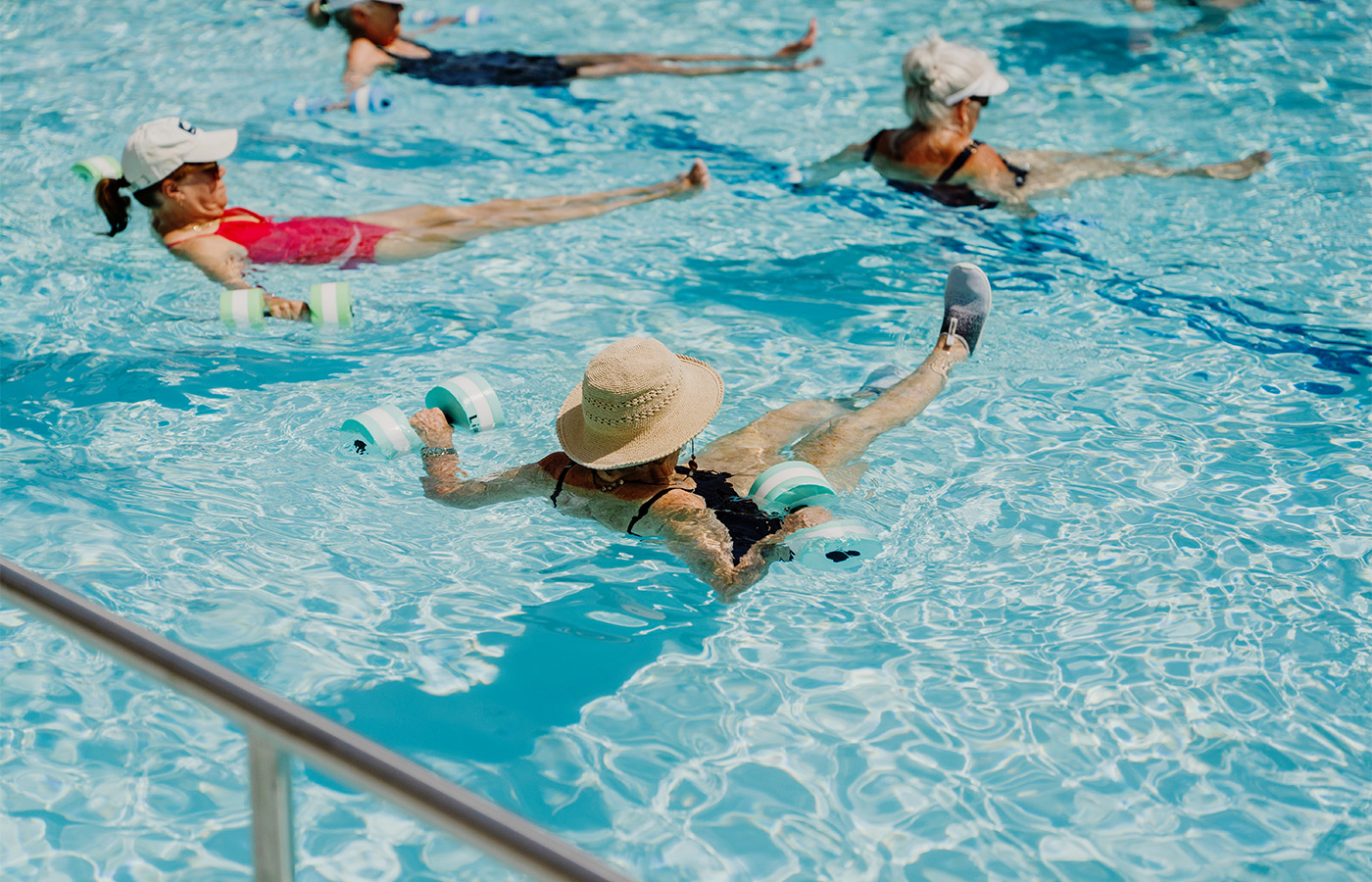 People in a water fitness class.