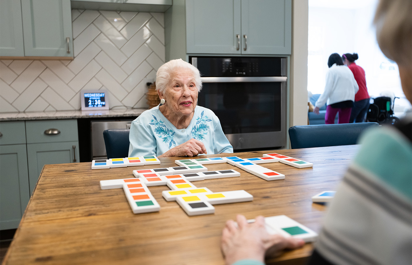 People playing a game at a table.