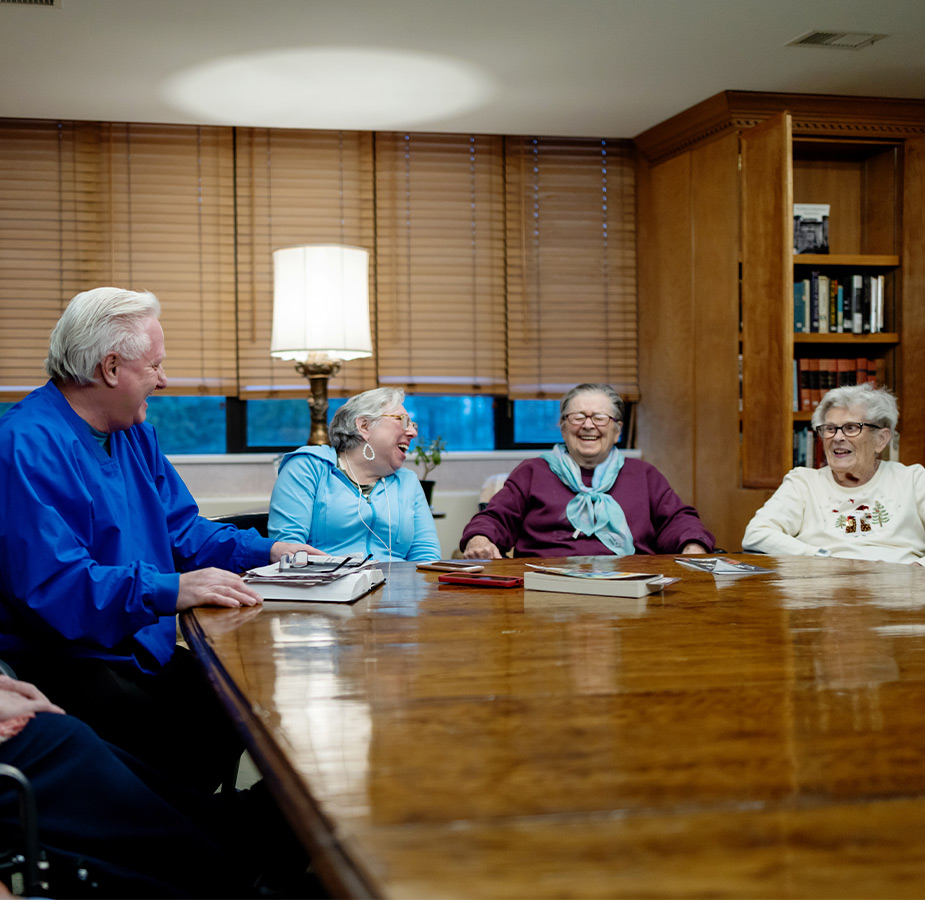 People at a table in the library.