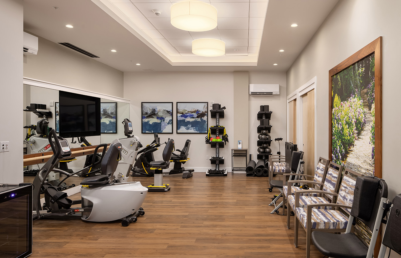 A fitness center with exercise equipment.