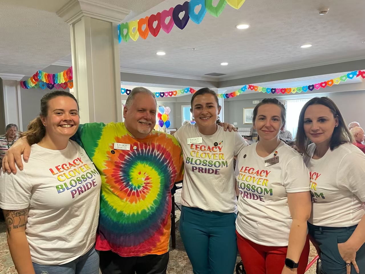 Associates are dressed up for Pride.