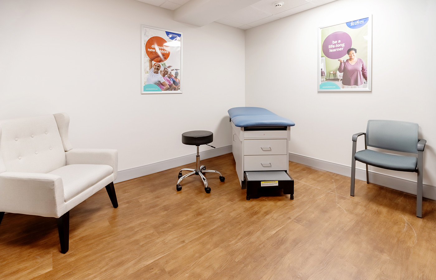 A clinic room with an exam table.