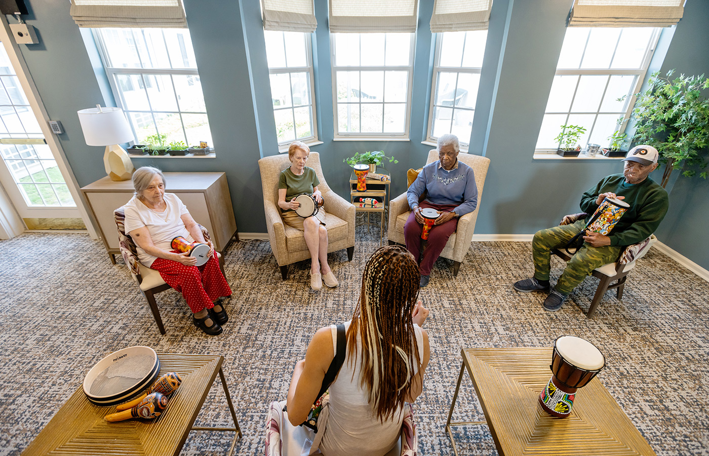 A group of people in a drum circle.