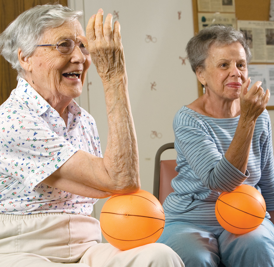 Two residents are in a fitness class.