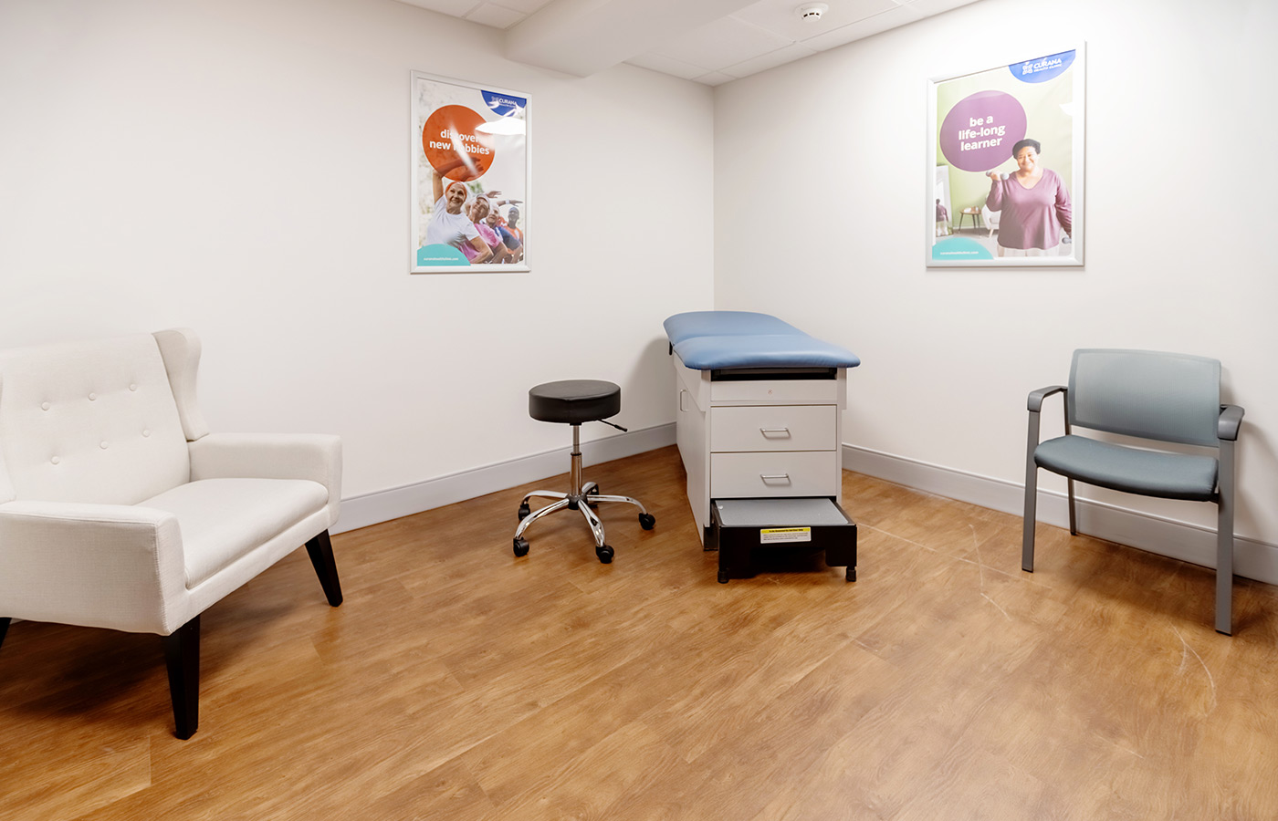 A clinic room with an exam table.