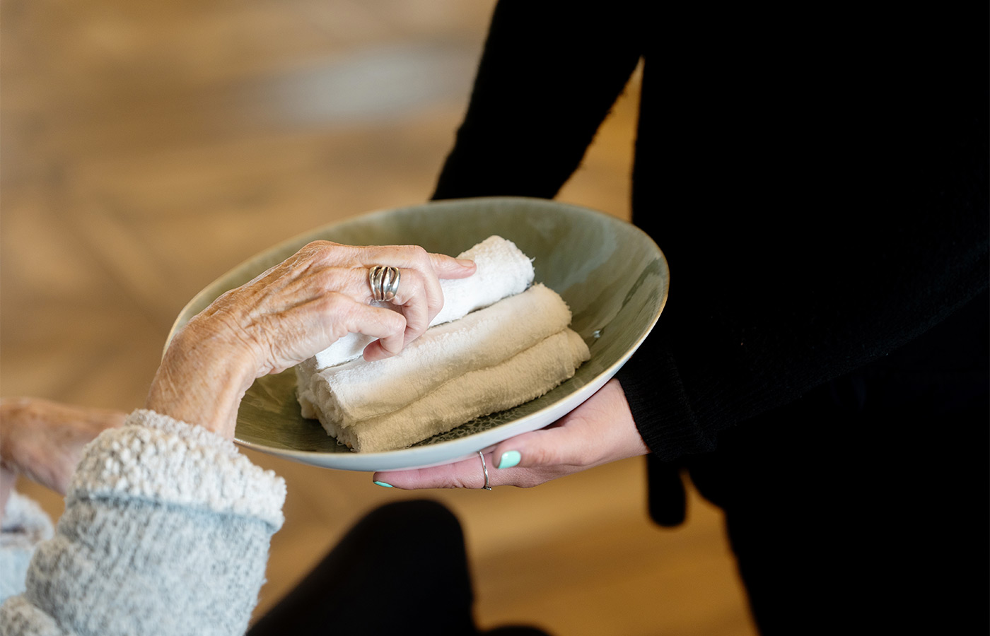 A person taking a hot towel.