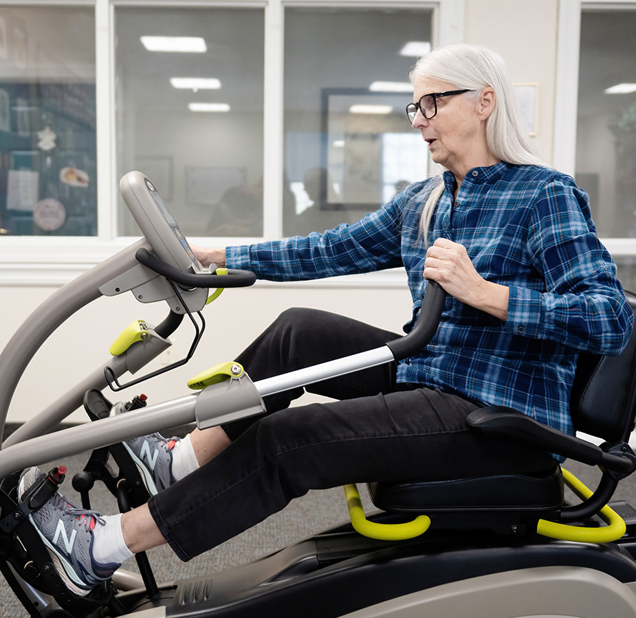 A person on a seated bike.