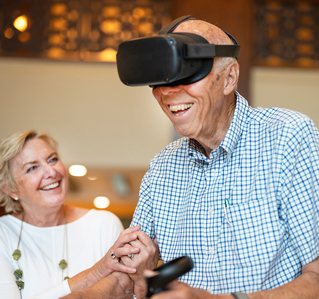A resident is using the Engage VR set.