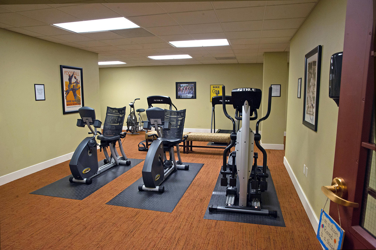 Fitness room with equipment.