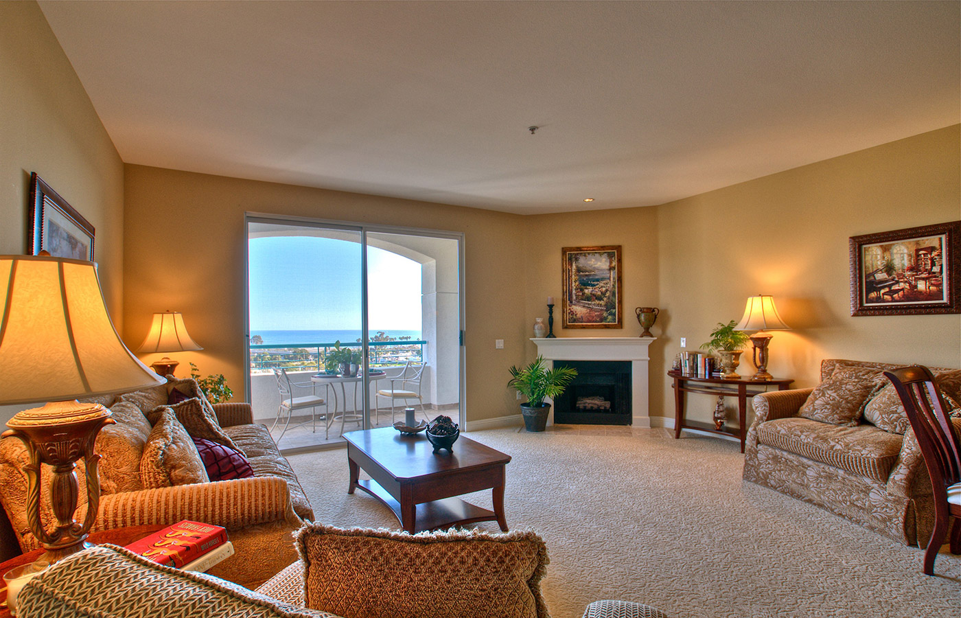 Furnished living room space with sofa, table, and seating area.