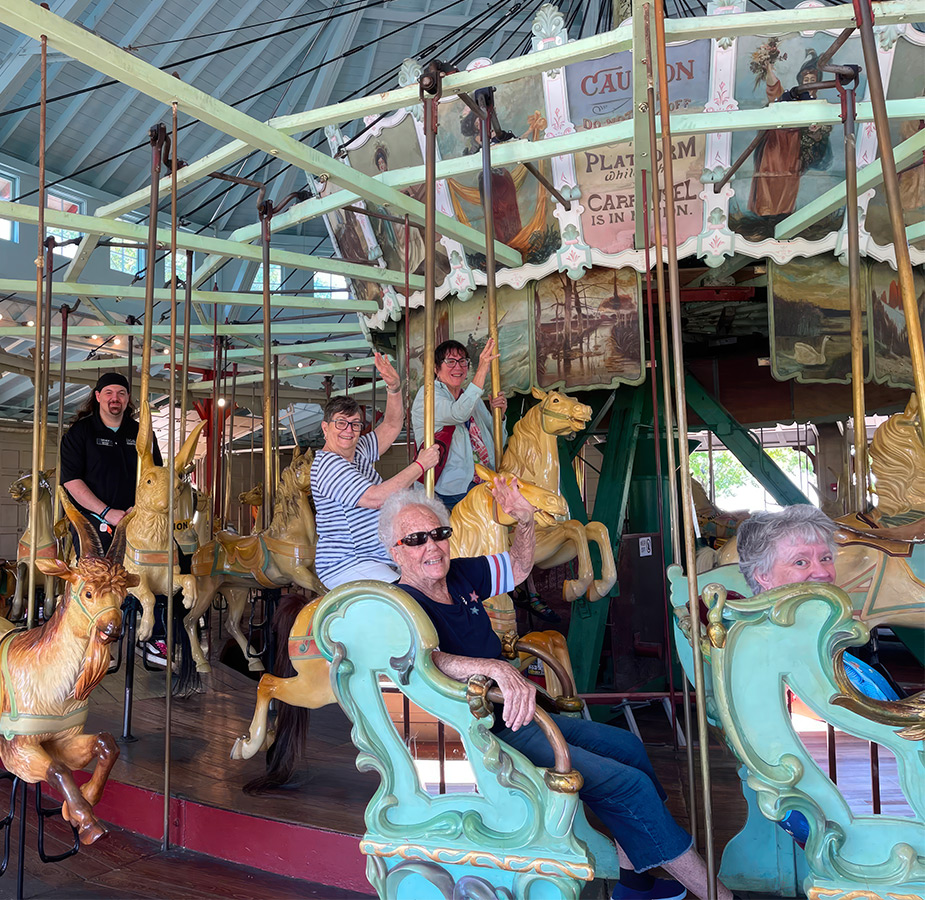 A group of people on a merry-go-round.