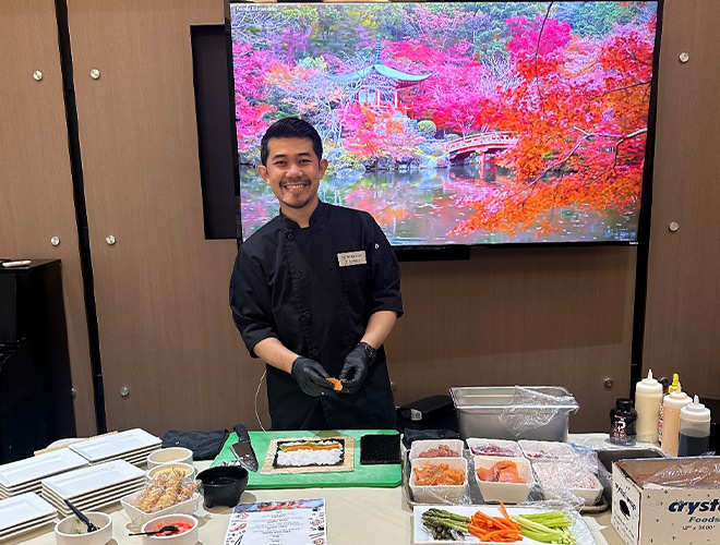 A chef teaching a sushi class.